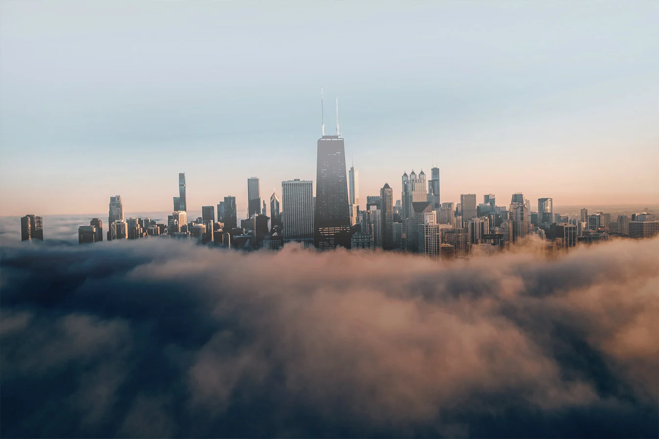 Chicago skyline rising above a low blanket of fog