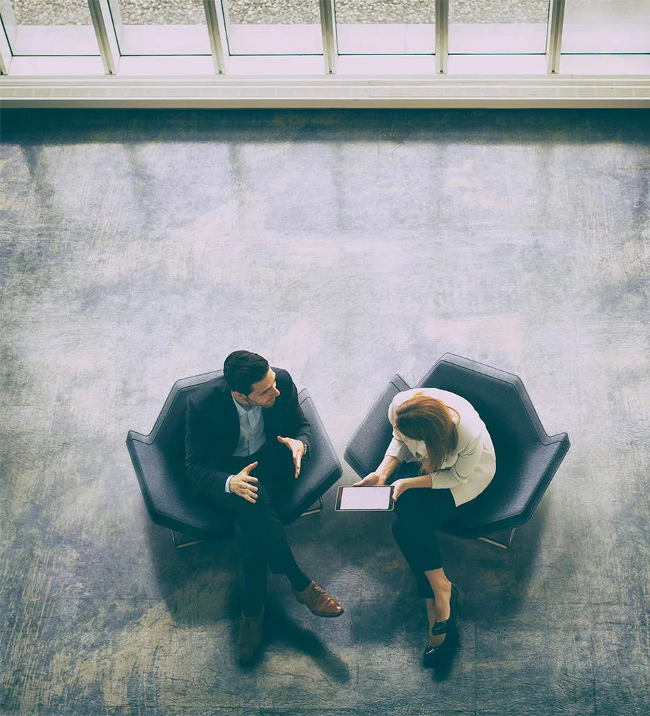 Two people discussing contract