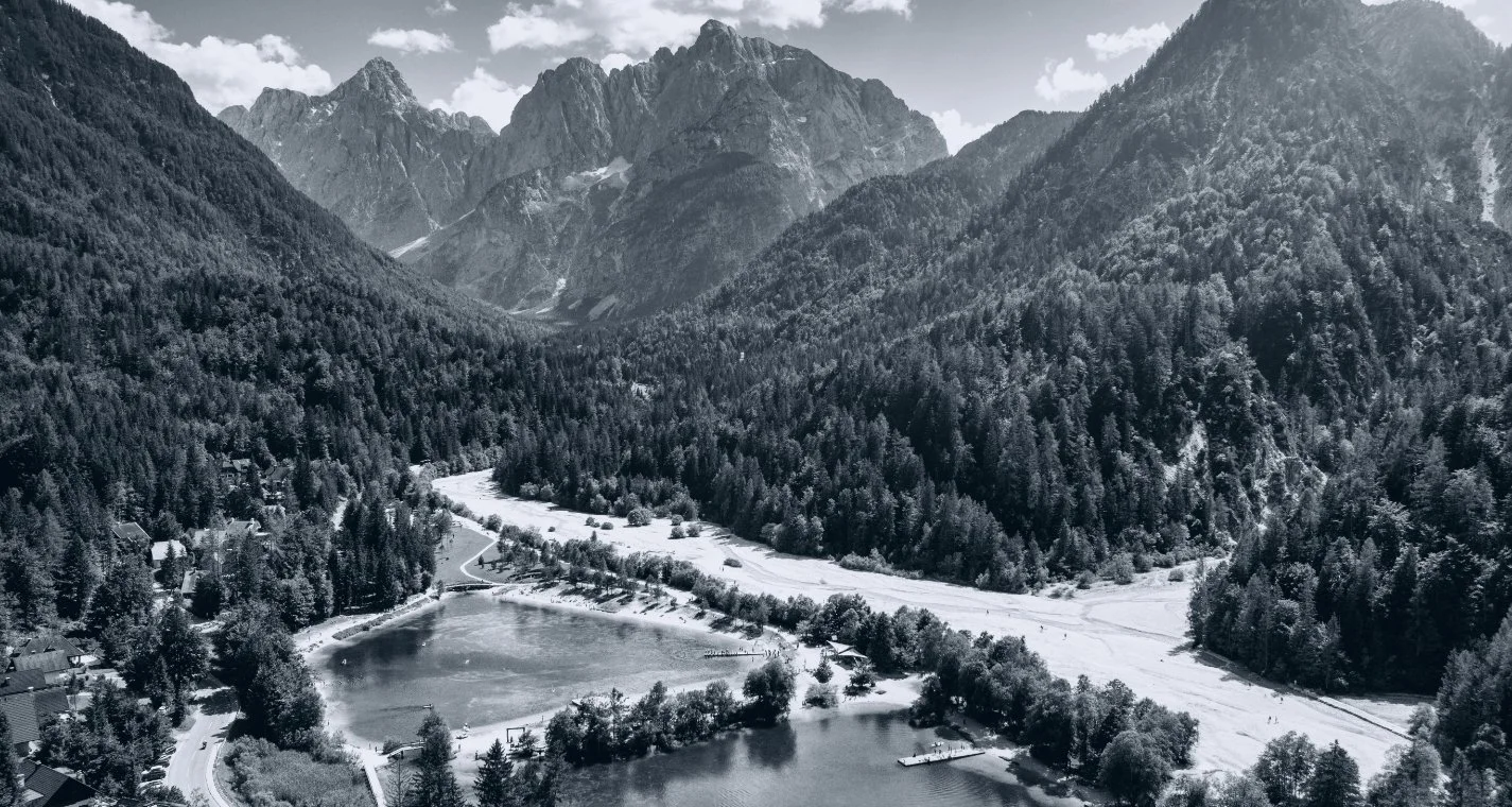 Aerial mountain valley and lake in black and white