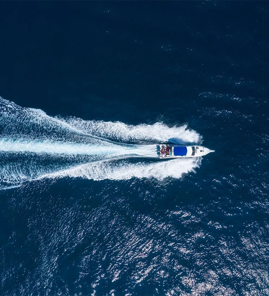 Speed boat traveling across ocean